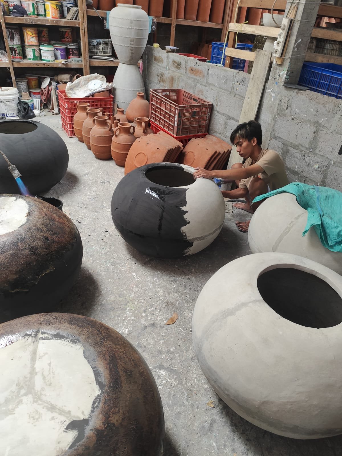 Artisan hand shaping pottery